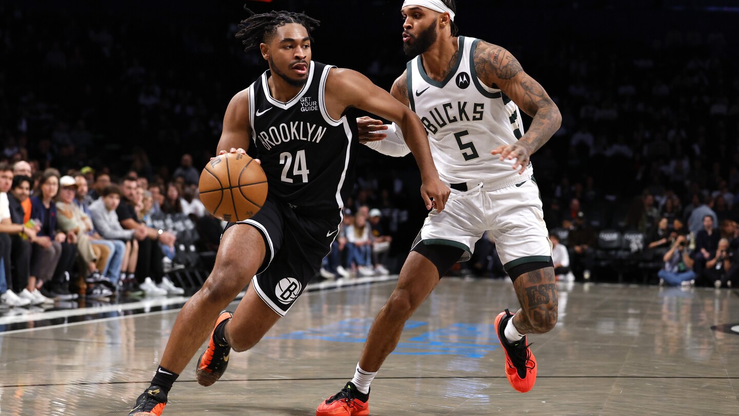 Thomas scores 32, Nets beat Bucks 115-102 in home opener for
